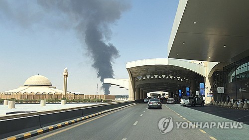 Smoke rising near fuel storage tanks at King Khalid International Airport in Riyadh