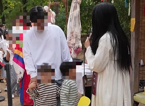 Five-year-old shields father during ghost attraction at Korean Folk Village